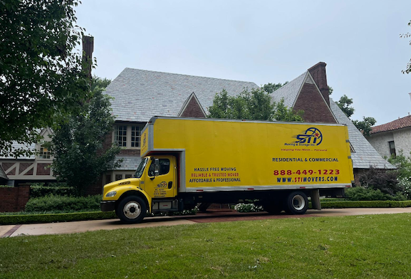 Moving truck parks outside someones house